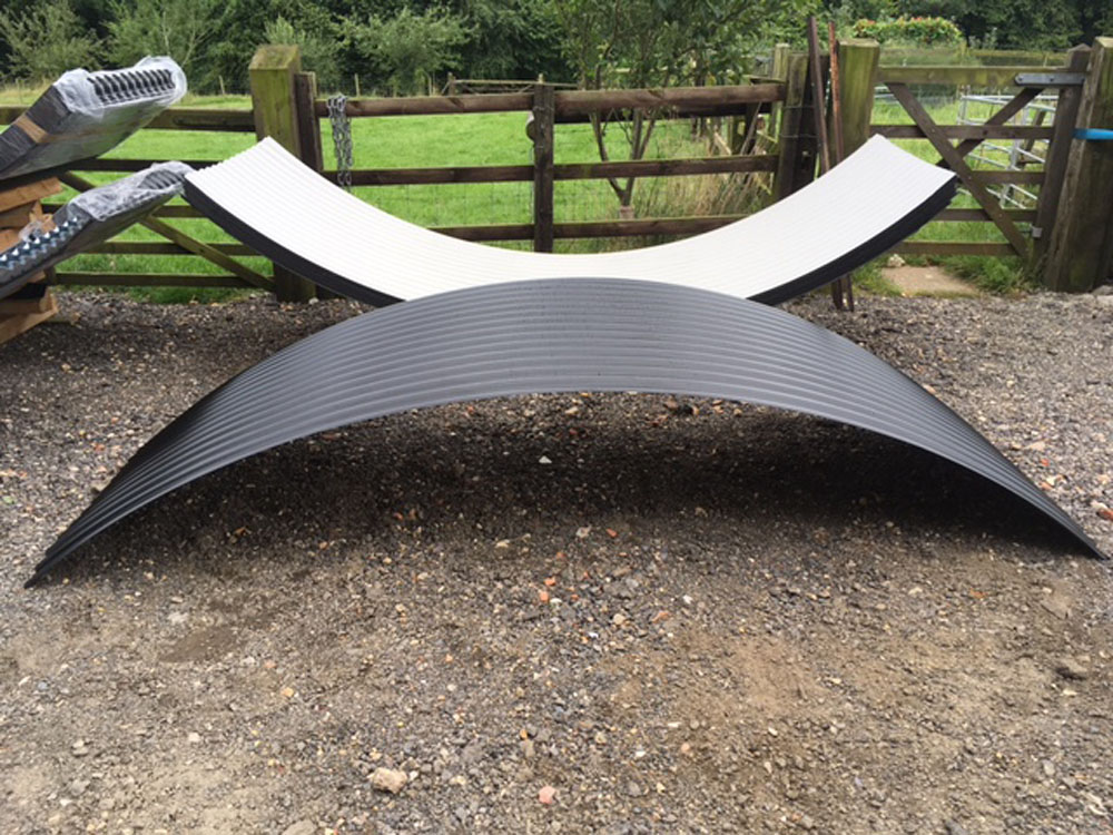 Curved corrugated roofing sheet for shepherd hut